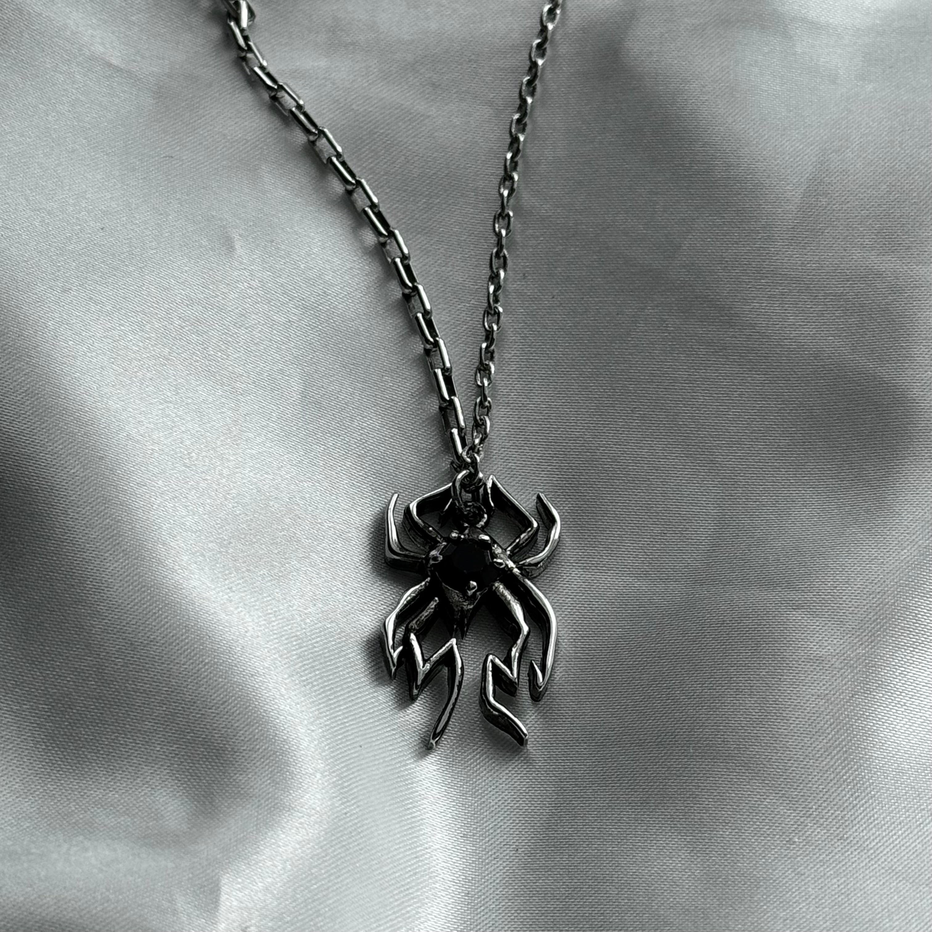 gibous spider black stone necklace