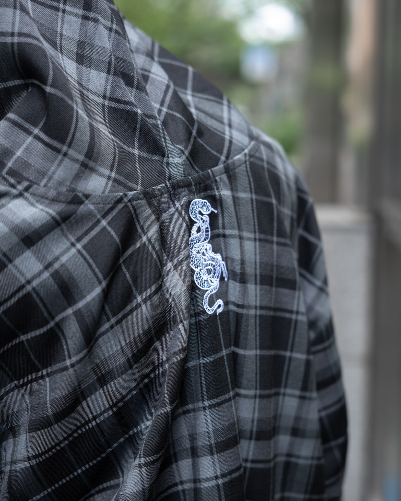 gibous logo snake check parker