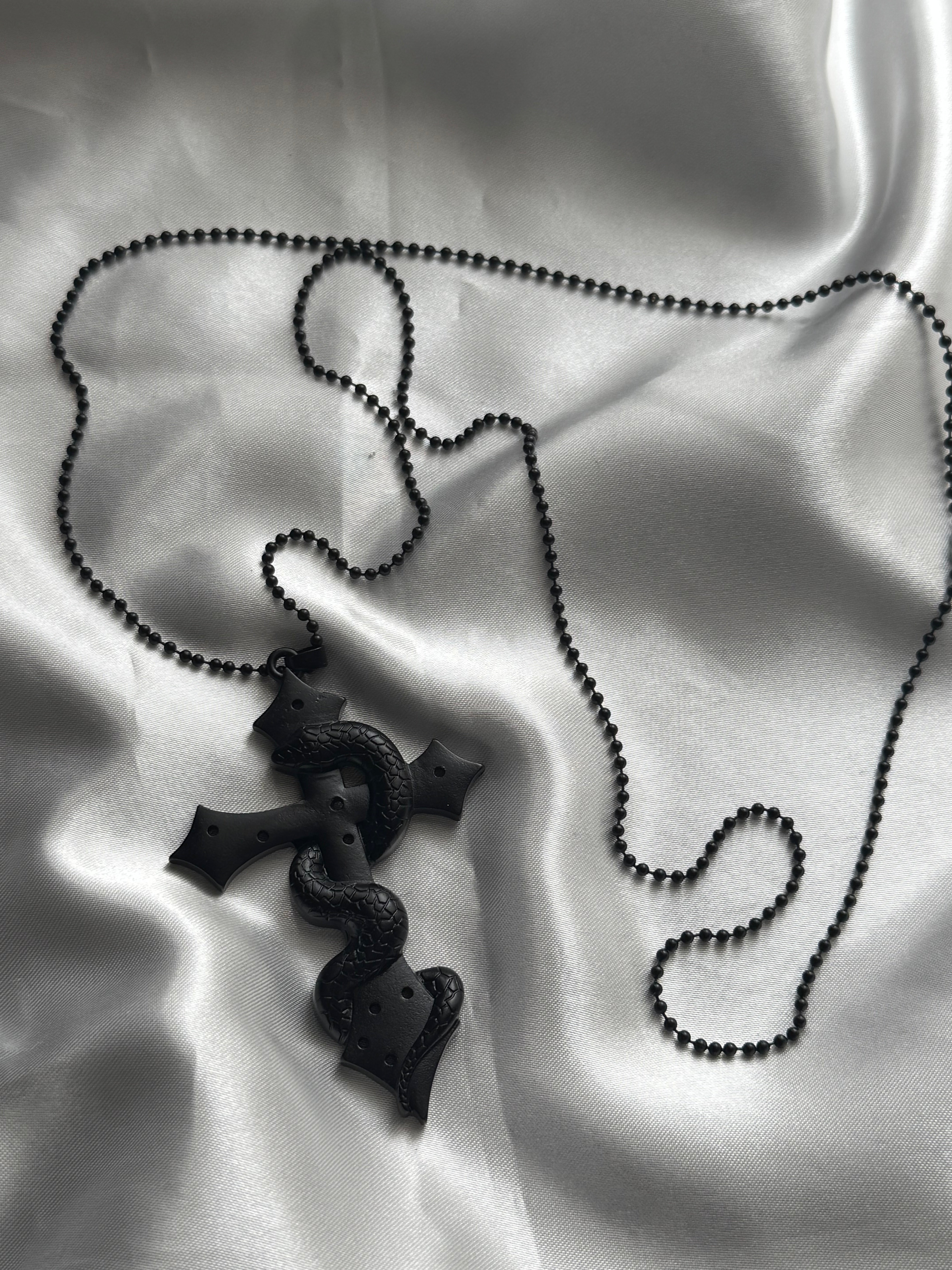 gibous snake cross pierce stock necklace black