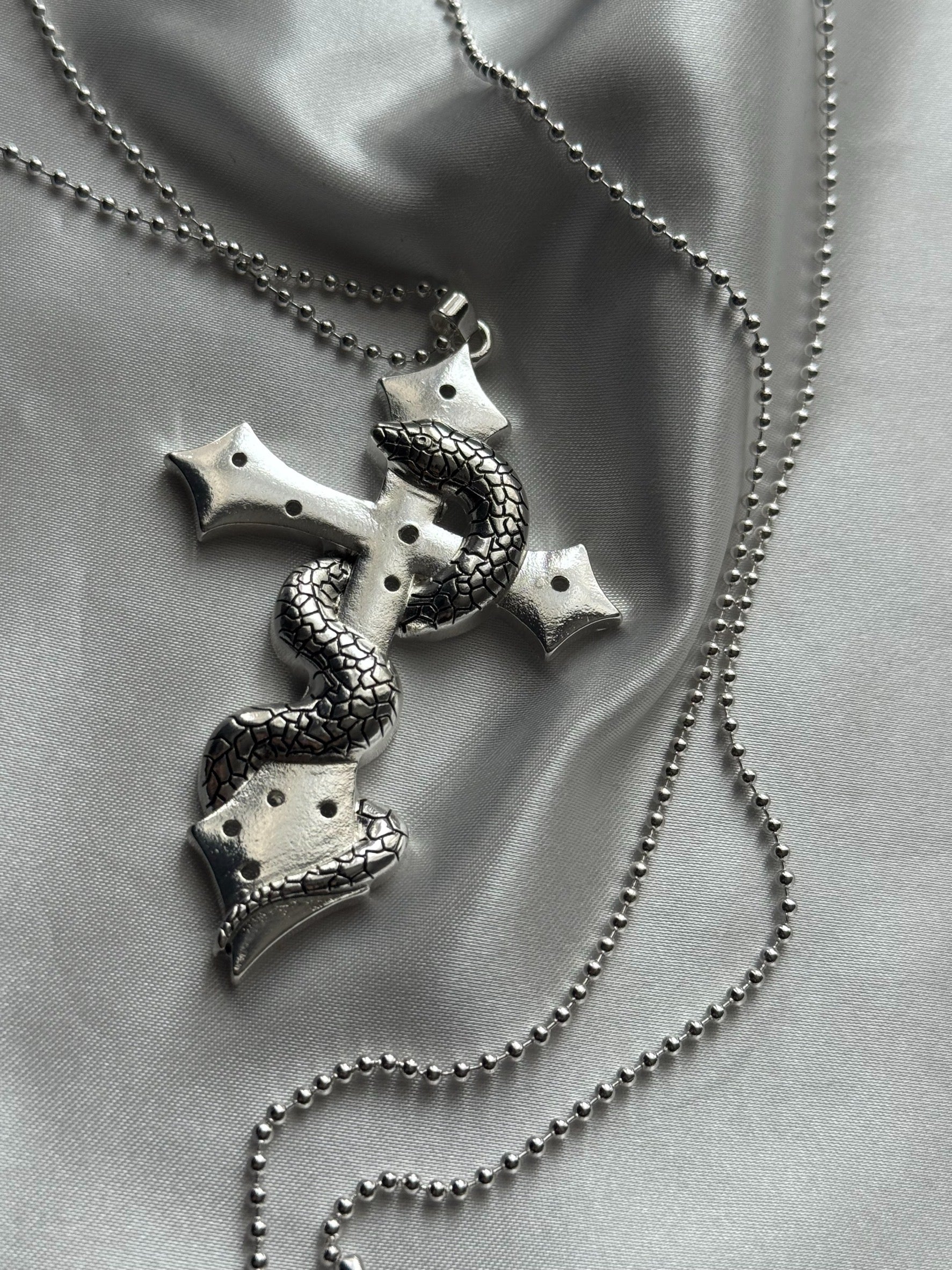 gibous snake cross pierce stock necklace silver