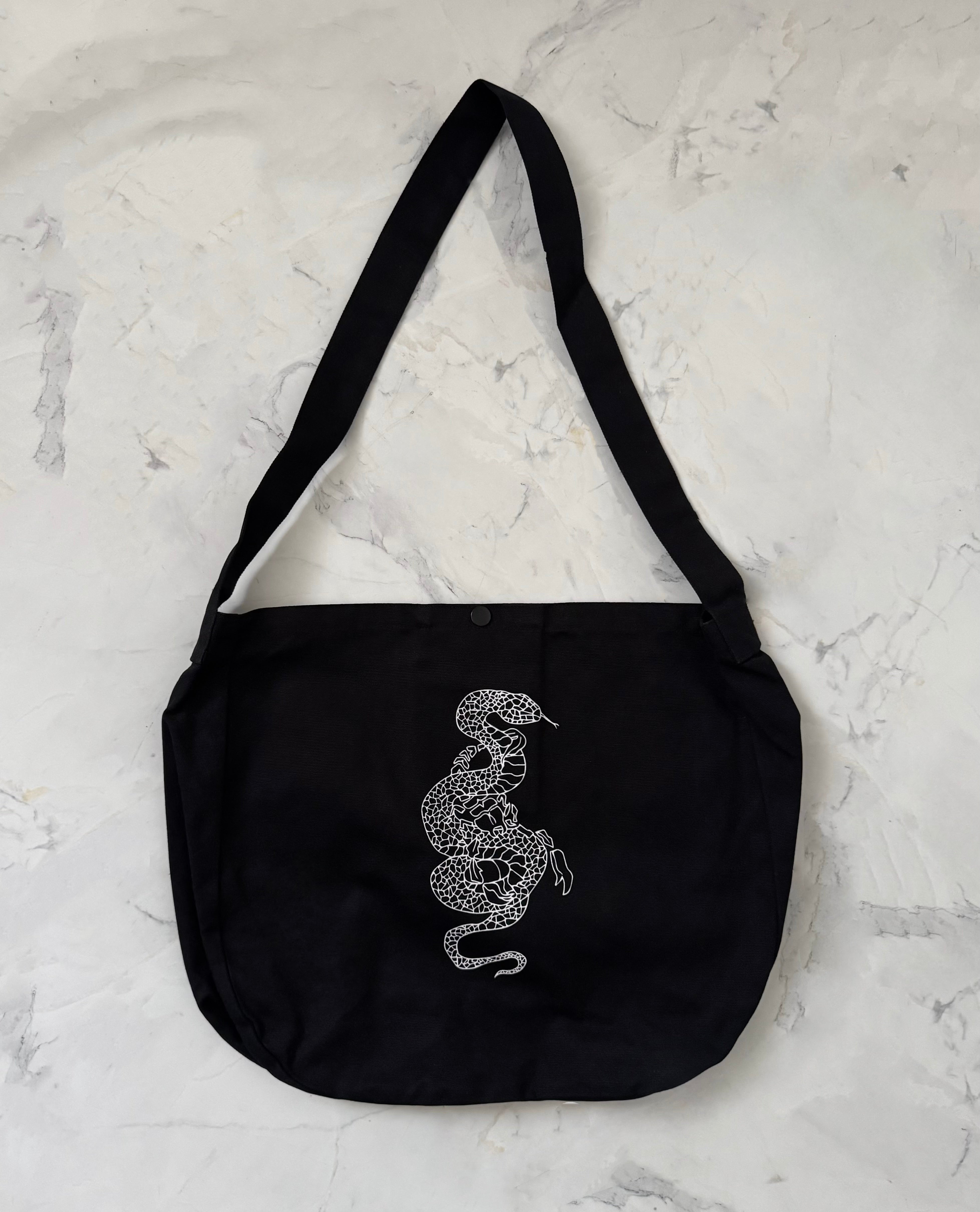 gibous snake scorpion newspaper bag