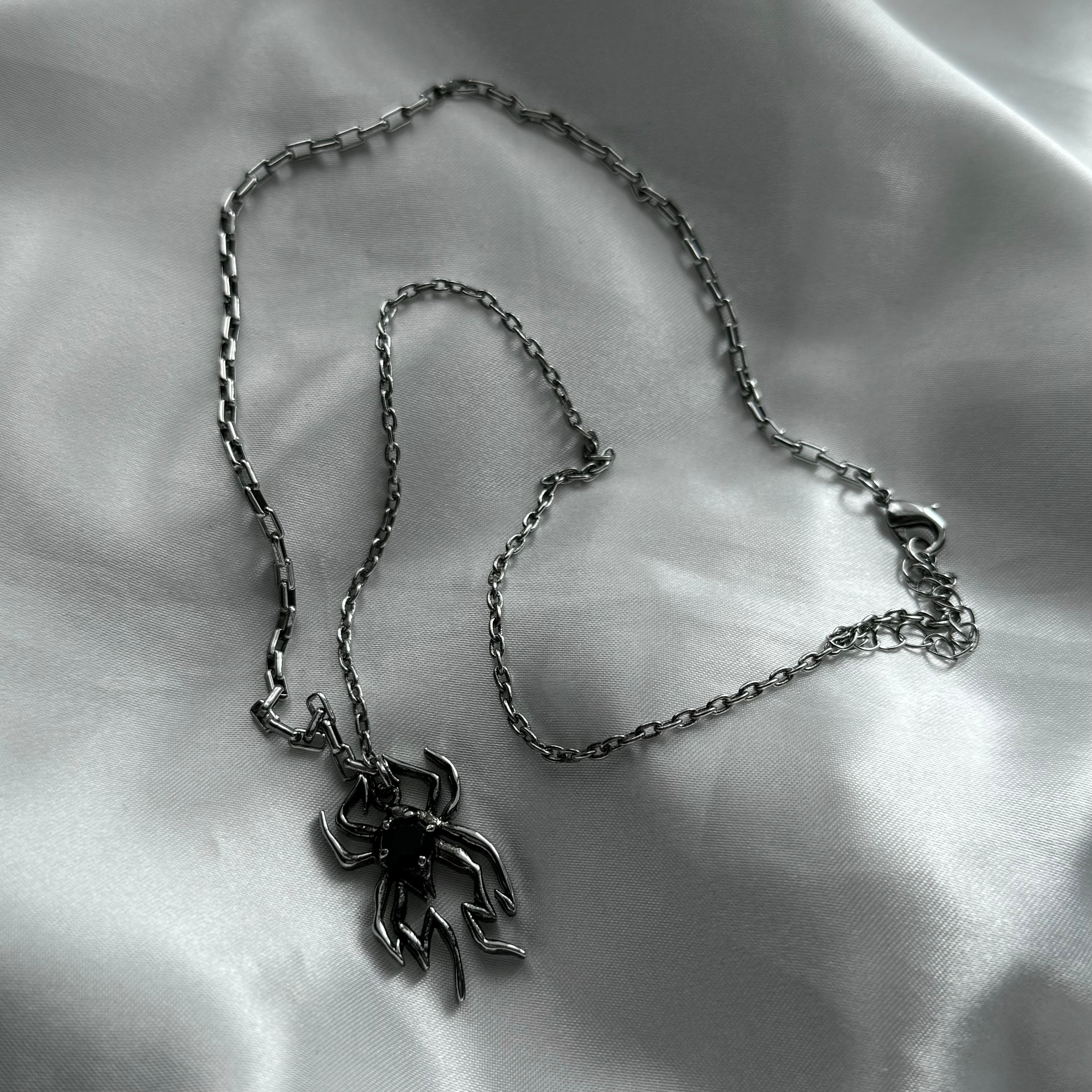 gibous spider black stone necklace