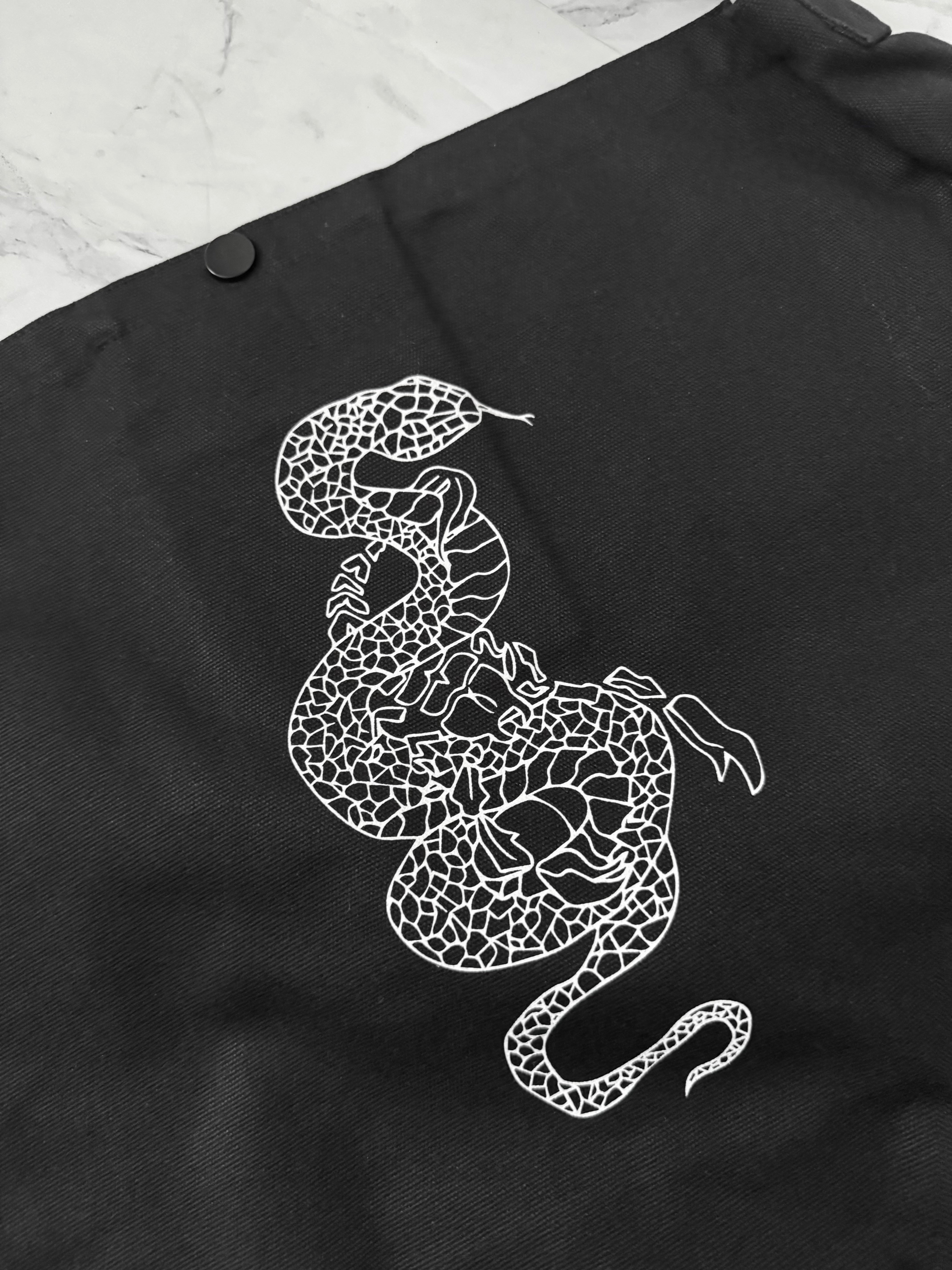 gibous snake scorpion newspaper bag