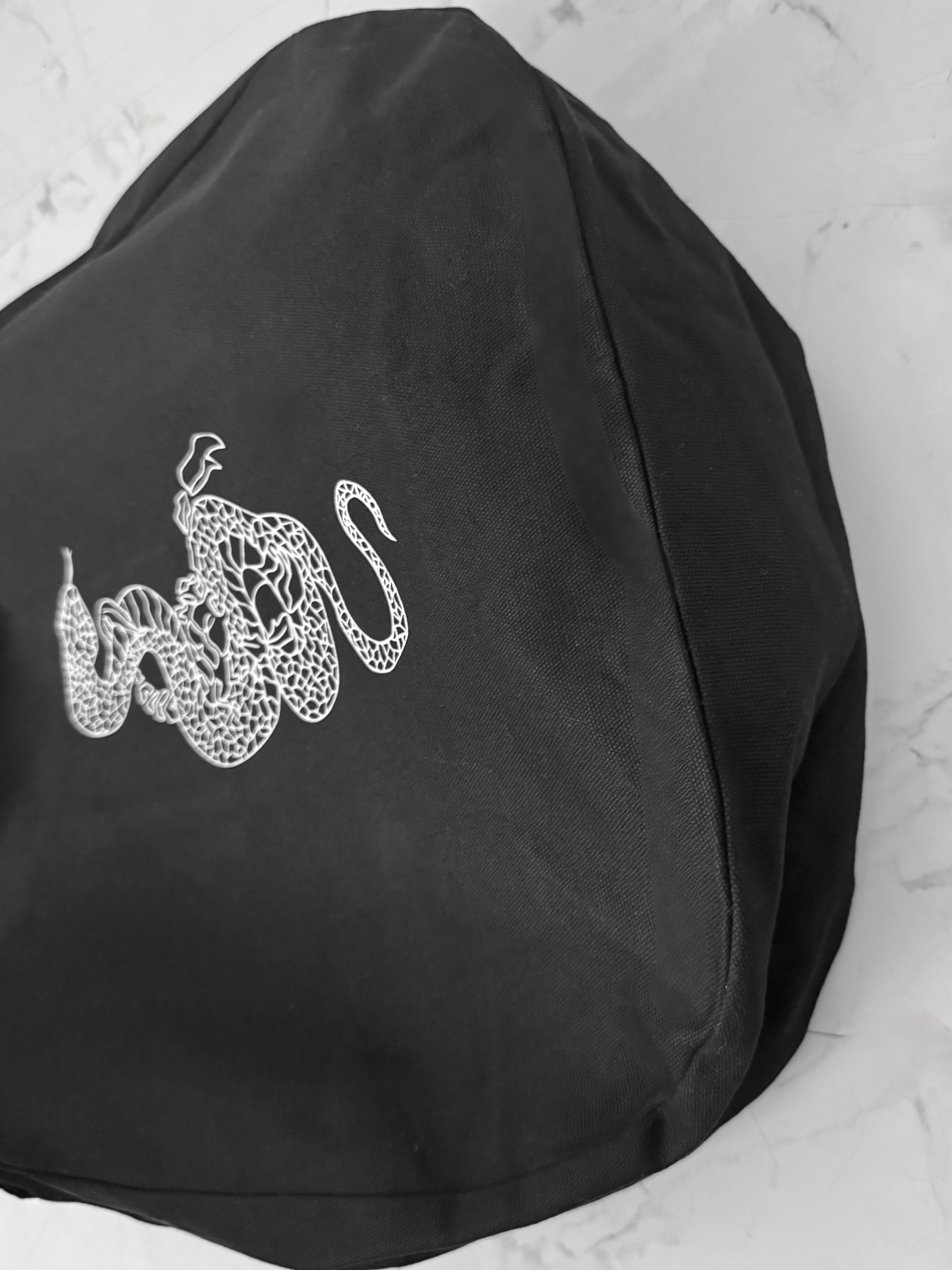gibous snake scorpion newspaper bag
