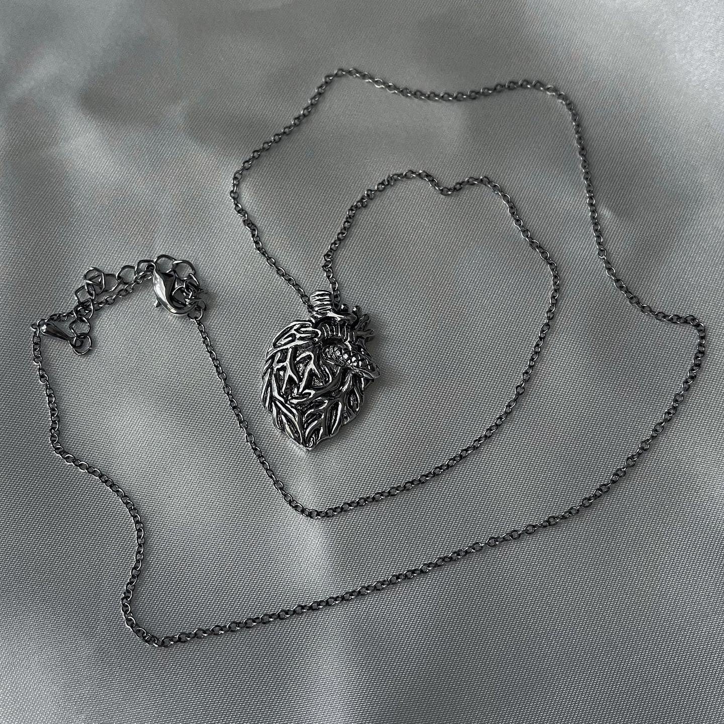 gibous snake heart necklace