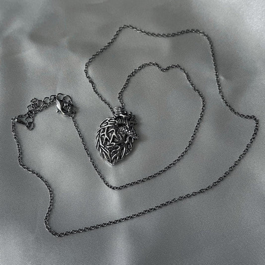 gibous snake heart necklace